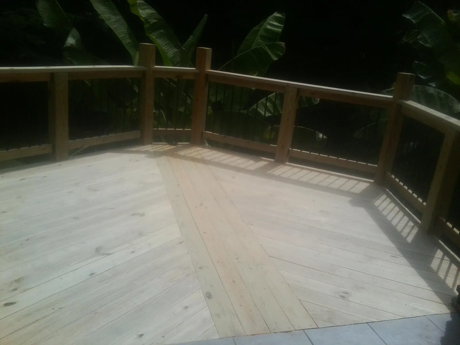 New wood deck and railing built off the back of a home in Cordova